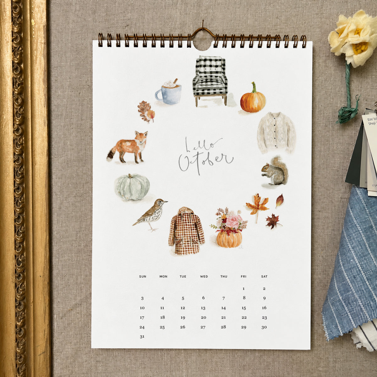 2027 hello month wall calendar October page with watercolor autumn icons like a fox, squirrel, pumpkins, and leaves