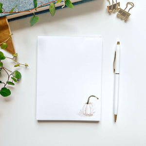 White pumpkin petite everyday notepad with a watercolor white pumpkin in the corner, beside a white pen
